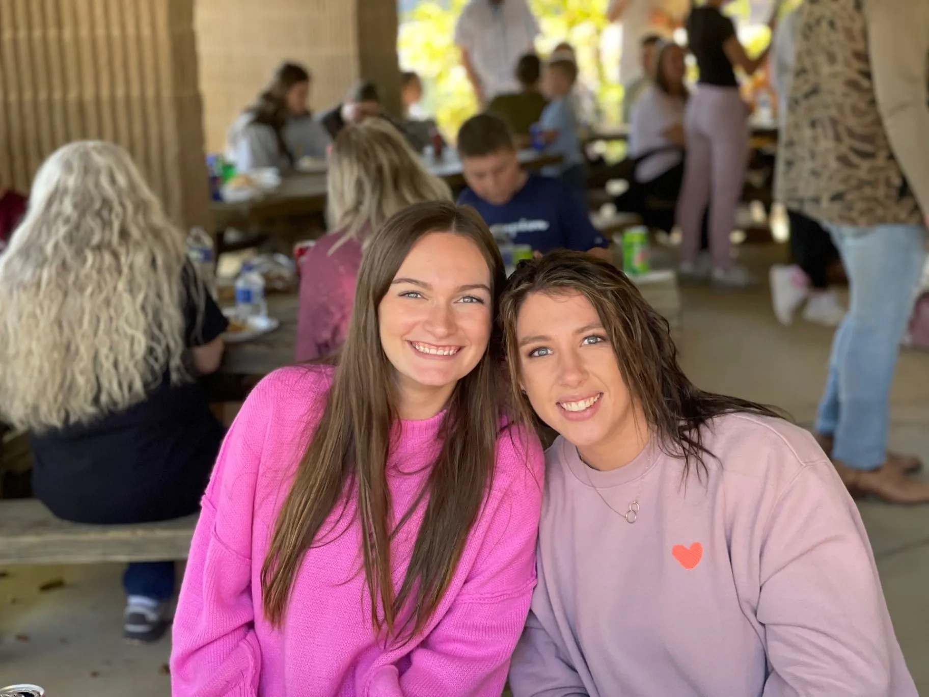Two Cornerstone Church friends smiling together during a fellowship meal